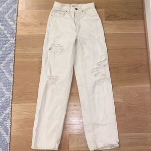 BDG, high-rise baggy distressed crème jeans.